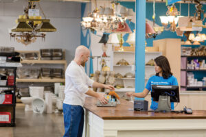 A customer checks out at a ReStore